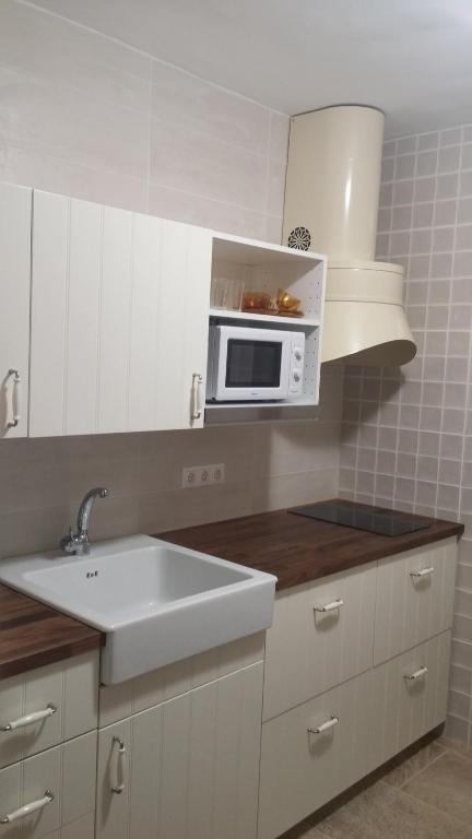 A kitchen or kitchenette at apartment a stone's throw from Santa Barbara