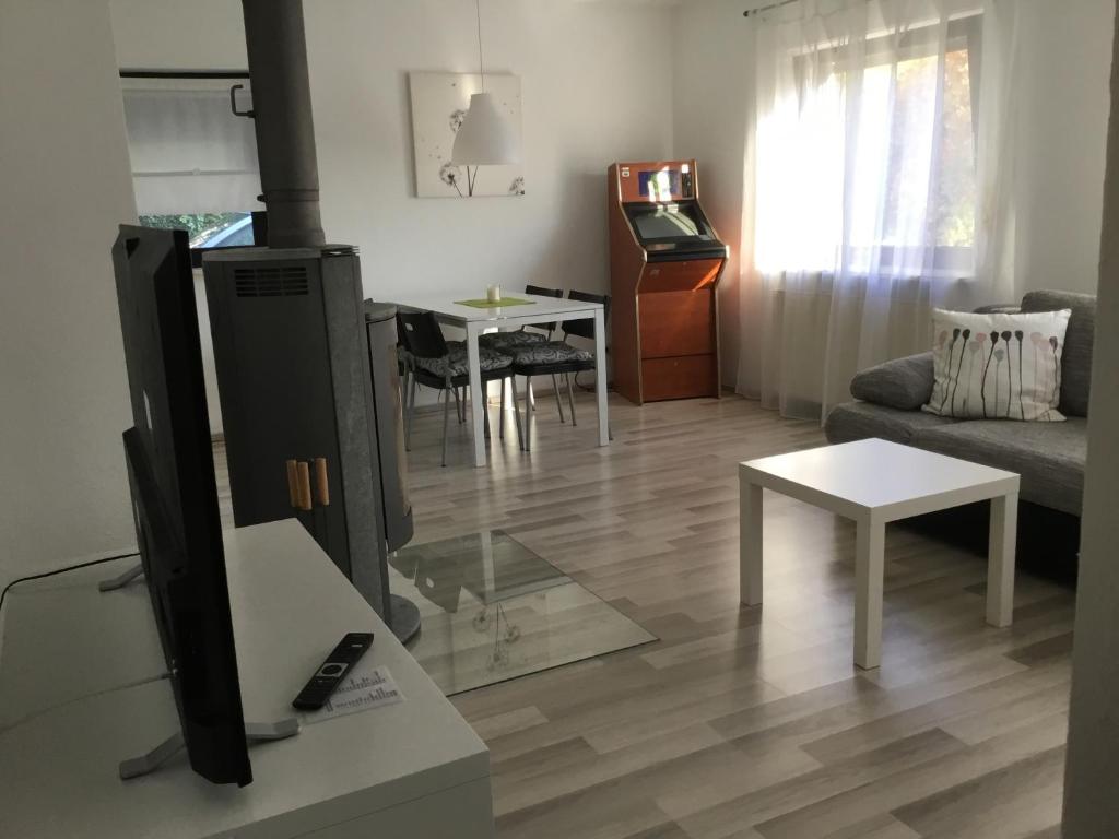 a living room with a couch and a table at Ferienwohnung Leitner in Laufenburg