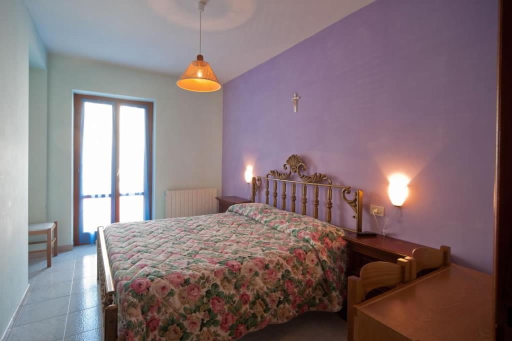 Postel nebo postele na pokoji v ubytování Hotel Cascia Ristorante