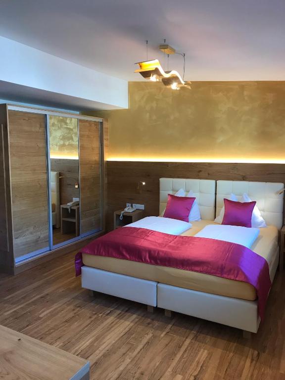 Postel nebo postele na pokoji v ubytování Berger's Sporthotel