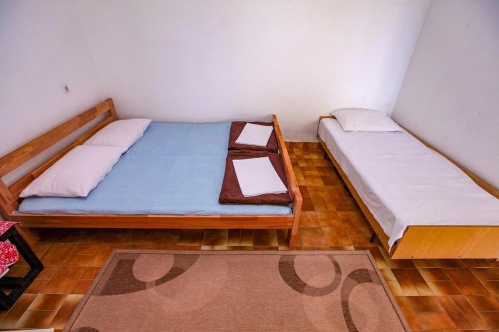 Postel nebo postele na pokoji v ubytování Apartments Terin