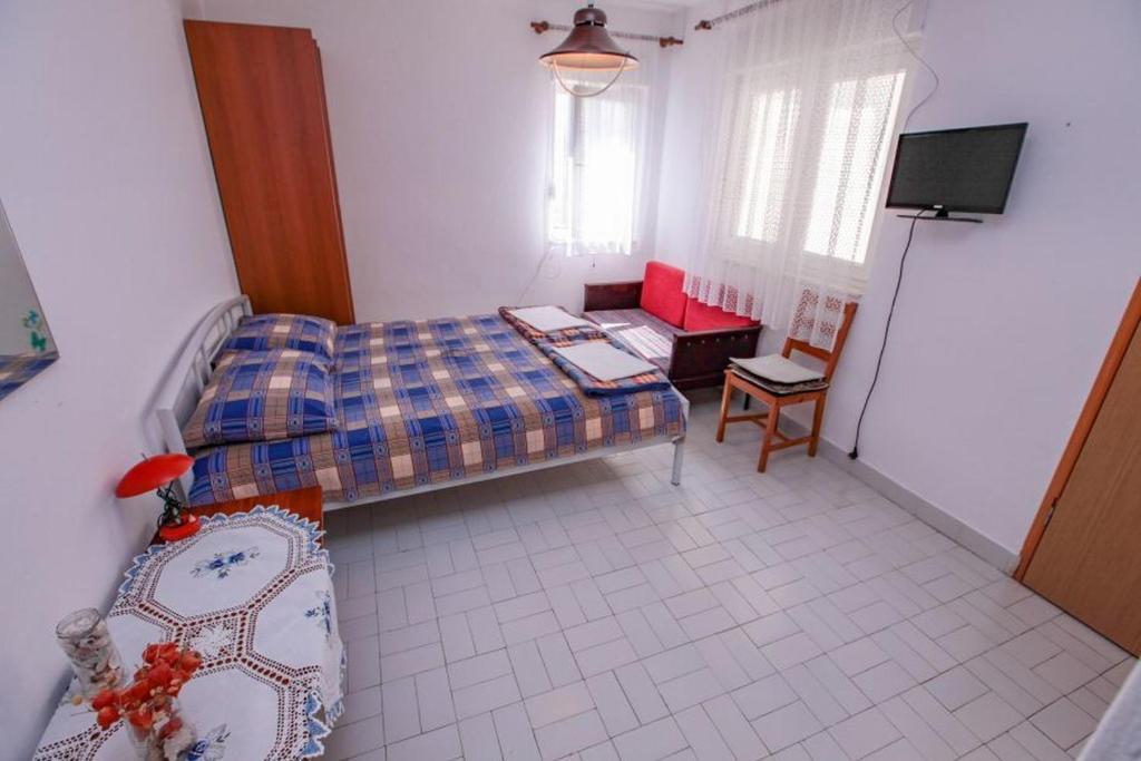 Postel nebo postele na pokoji v ubytování Apartments Terin