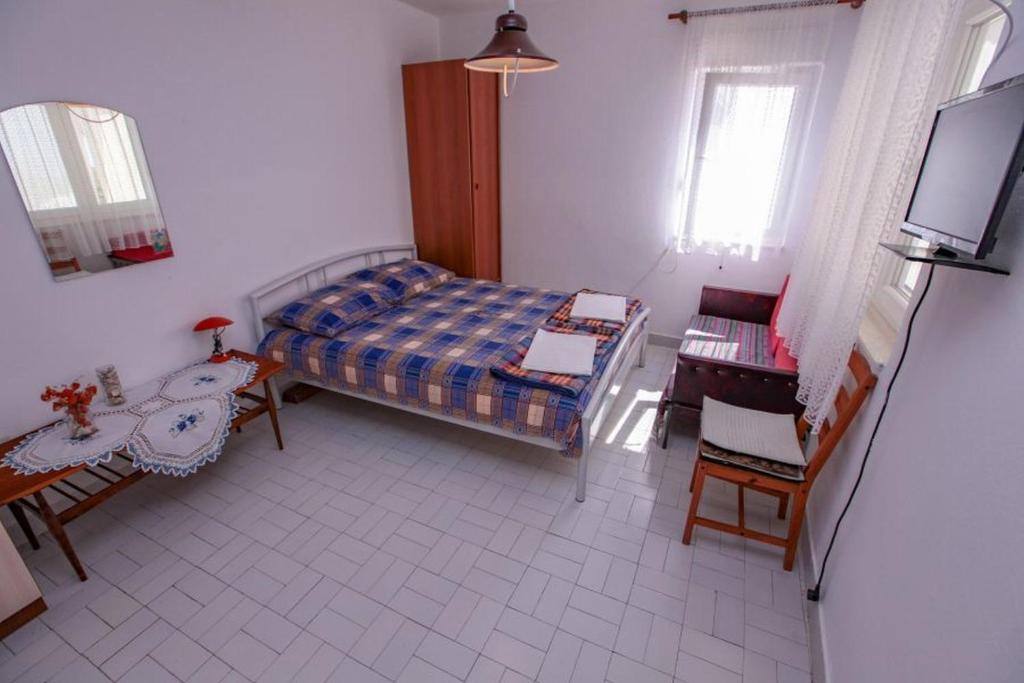 Postel nebo postele na pokoji v ubytování Apartments Terin