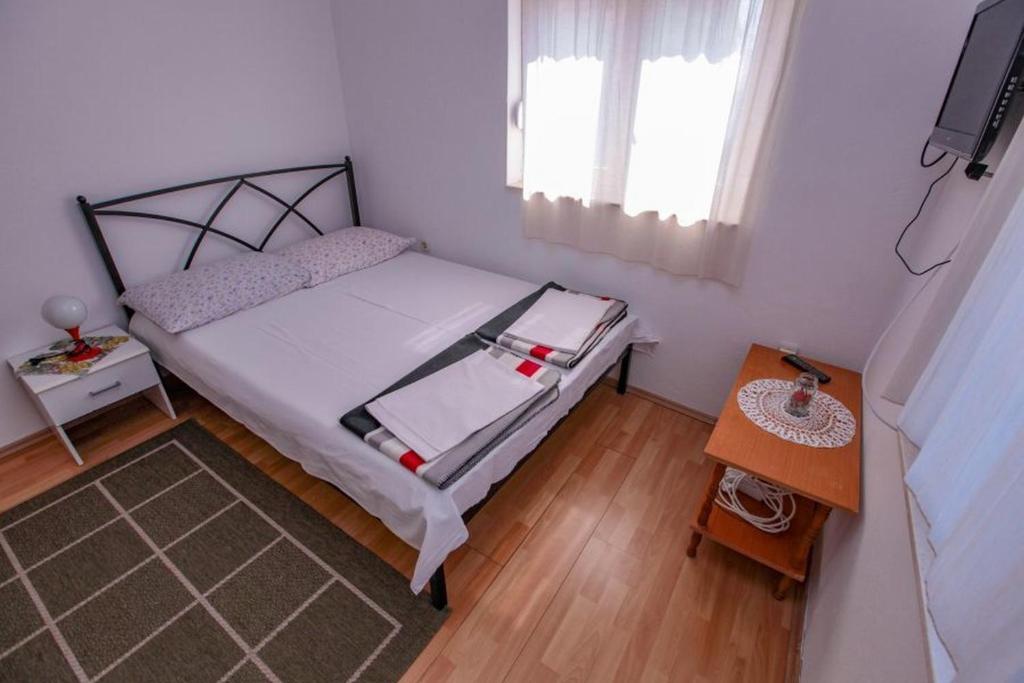Postel nebo postele na pokoji v ubytování Apartments Terin
