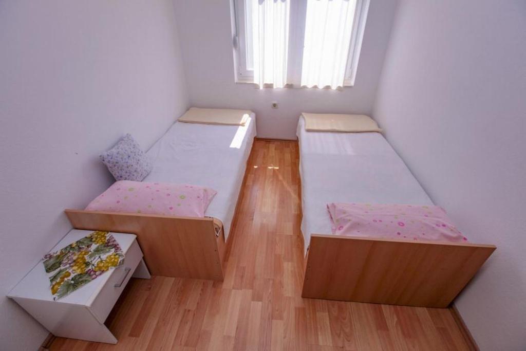Postel nebo postele na pokoji v ubytování Apartments Terin