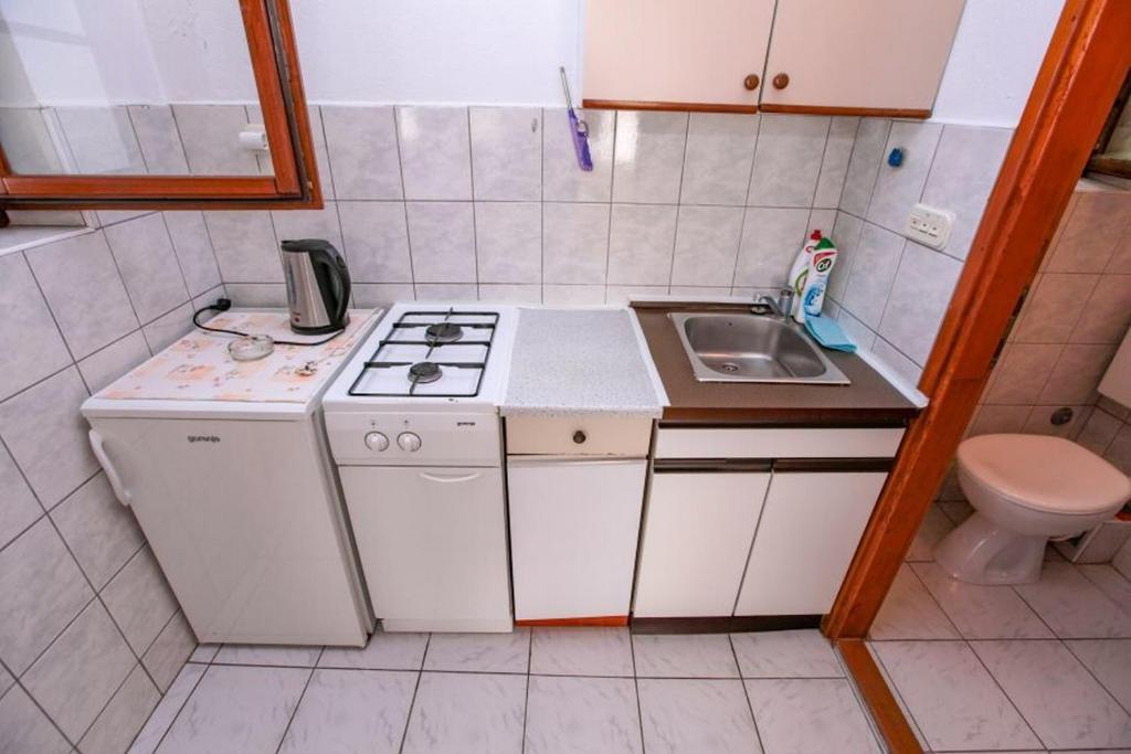 Kuchyň nebo kuchyňský kout v ubytování Apartments Terin