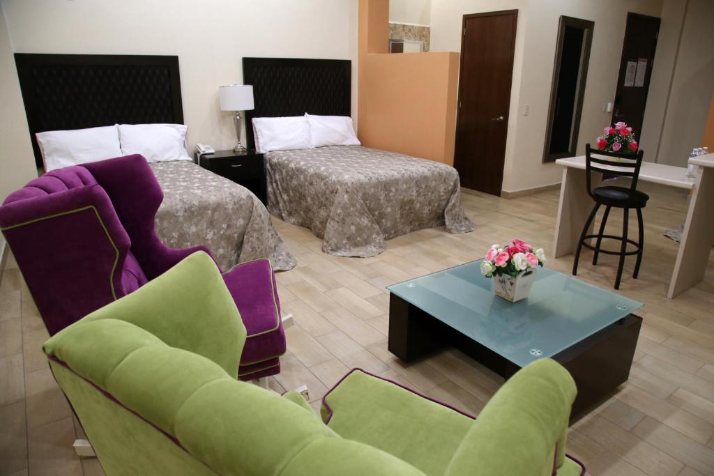 Postel nebo postele na pokoji v ubytování Hotel Plaza Bernal