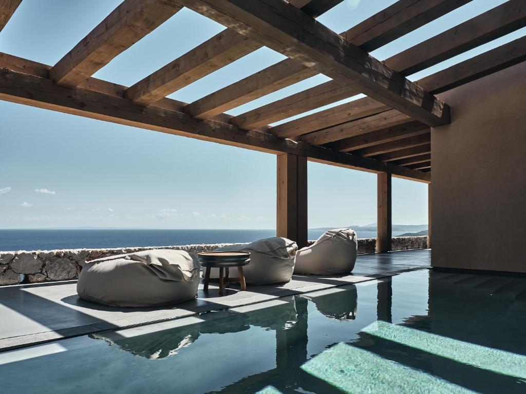 a swimming pool with a view of the ocean at Vais Luxury Villas in Agios Nikolaos