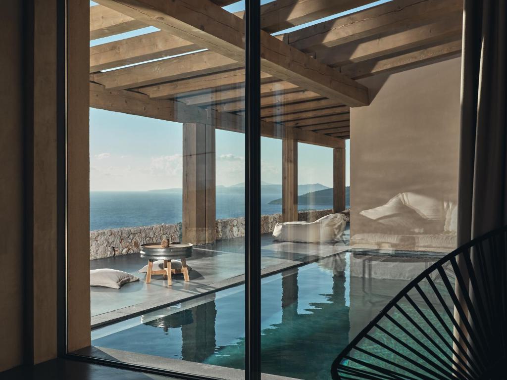 a swimming pool with a view of the ocean at Vais Luxury Villas in Agios Nikolaos