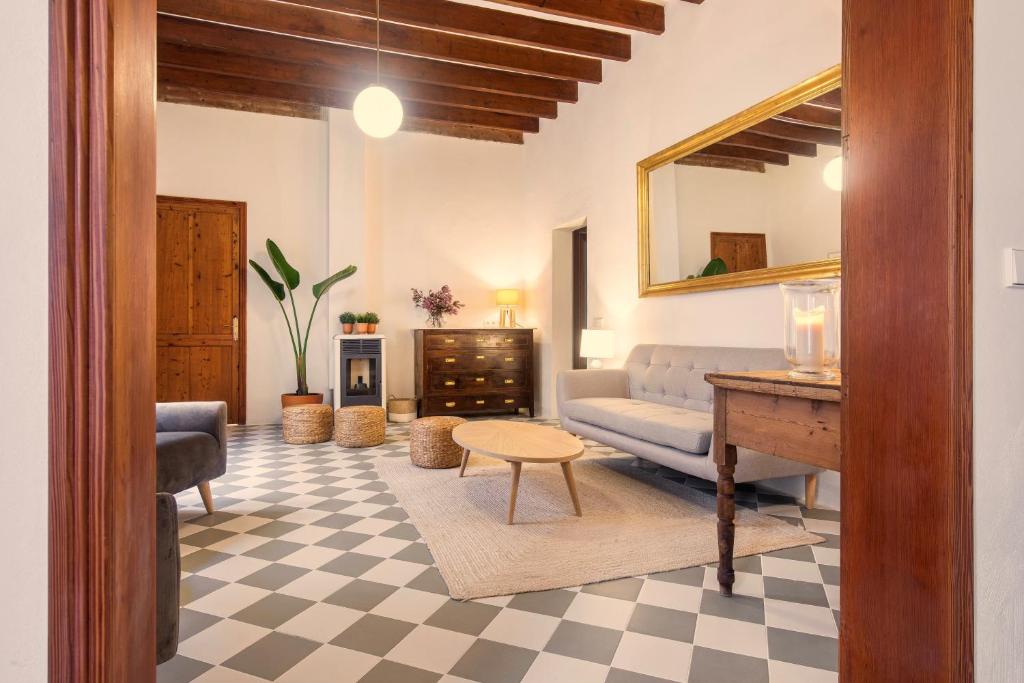 a living room with a couch and a table at Senda Caimari in Caimari