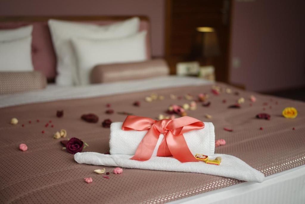 Postel nebo postele na pokoji v ubytování Hotel Royal Gold City