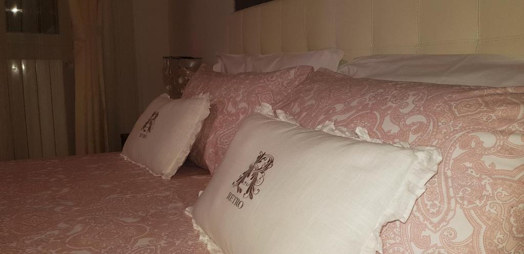 A bed or beds in a room at L'oasi di Ambra