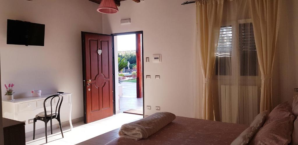 A bed or beds in a room at L'oasi di Ambra