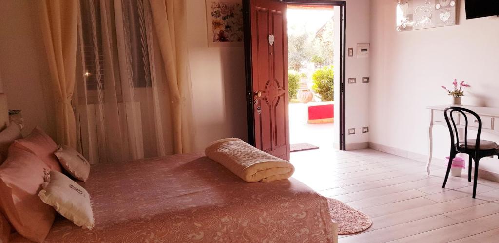 A bed or beds in a room at L'oasi di Ambra
