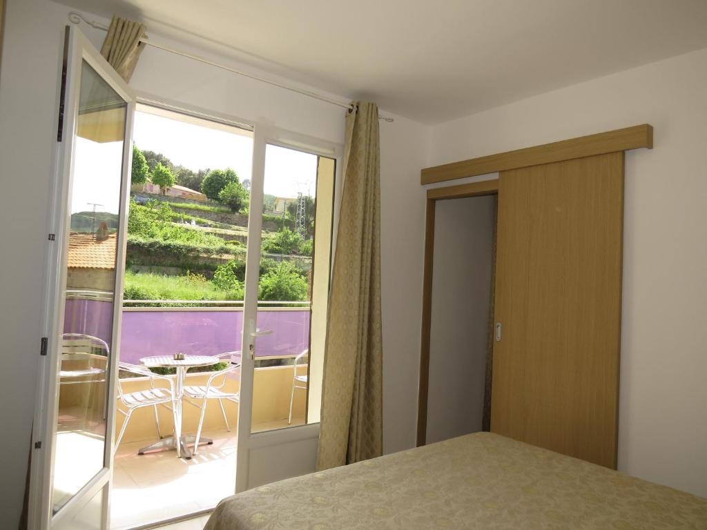 Postel nebo postele na pokoji v ubytování Hôtel Mare E Monti