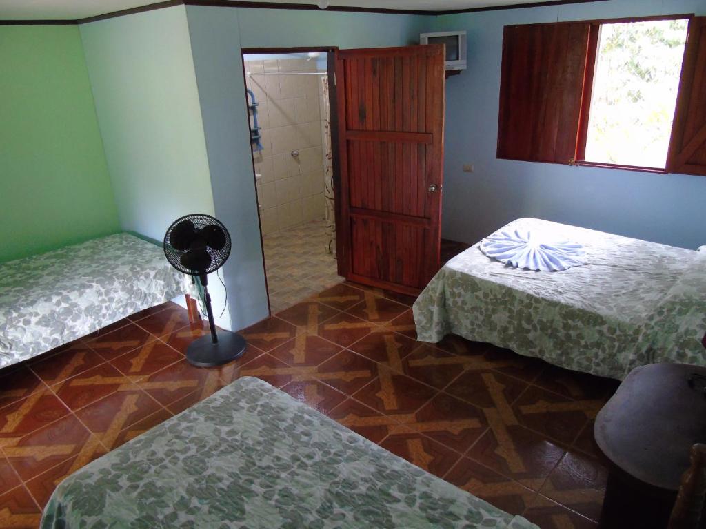 Postel nebo postele na pokoji v ubytování Posada Rural Río Celeste