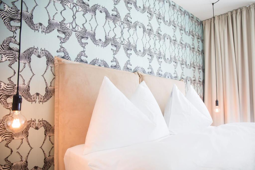 Postel nebo postele na pokoji v ubytování Gubelhof Suites