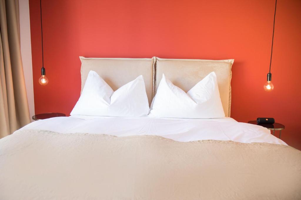 Postel nebo postele na pokoji v ubytování Gubelhof Suites