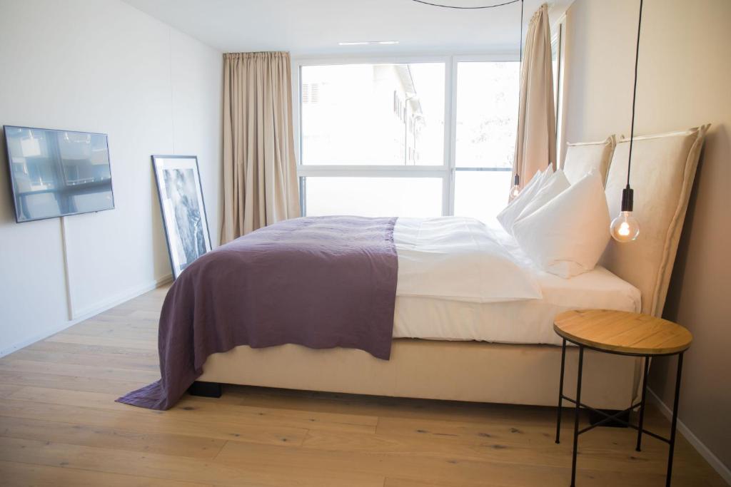 Postel nebo postele na pokoji v ubytování Gubelhof Suites