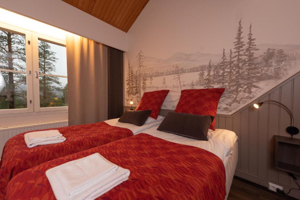 Postel nebo postele na pokoji v ubytování Hotel Ylläsrinne
