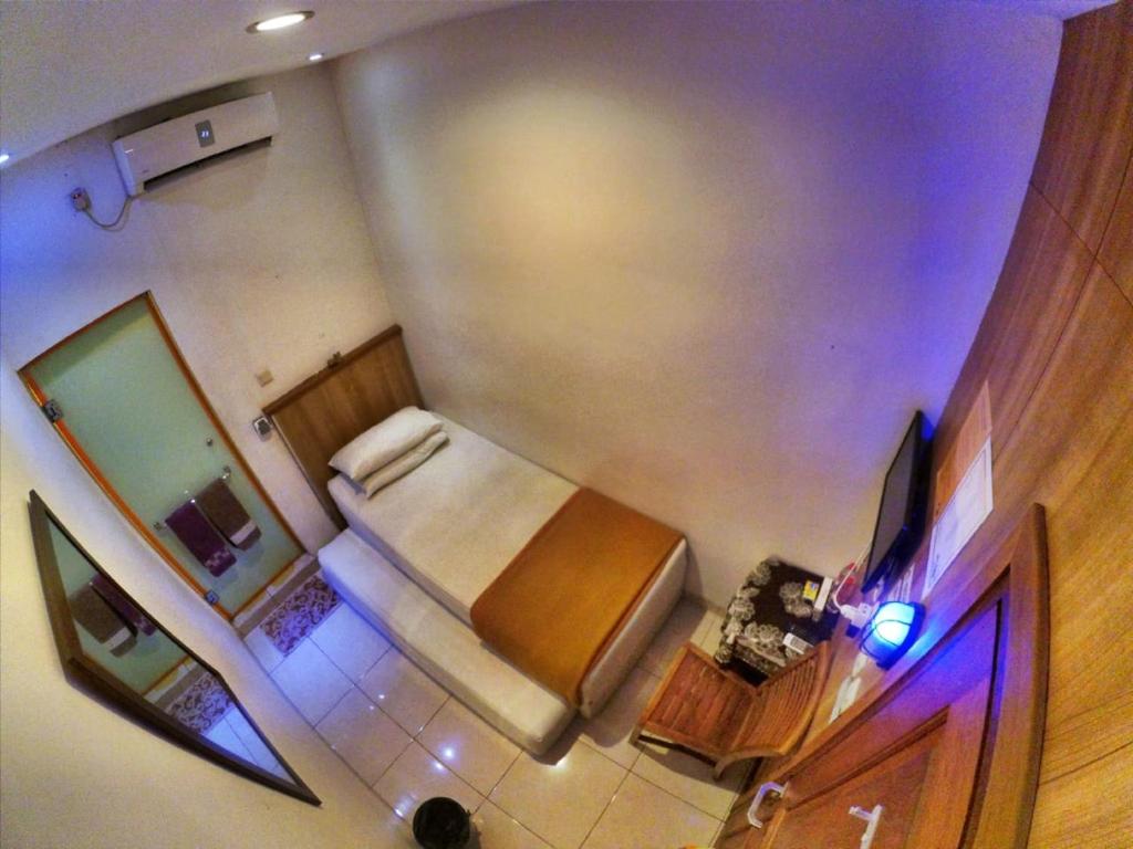 TV a/nebo společenská místnost v ubytování Cabin Hotel Bhayangkara