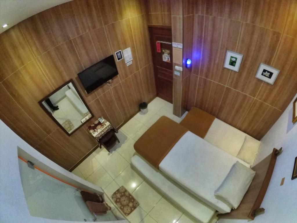 TV a/nebo společenská místnost v ubytování Cabin Hotel Bhayangkara