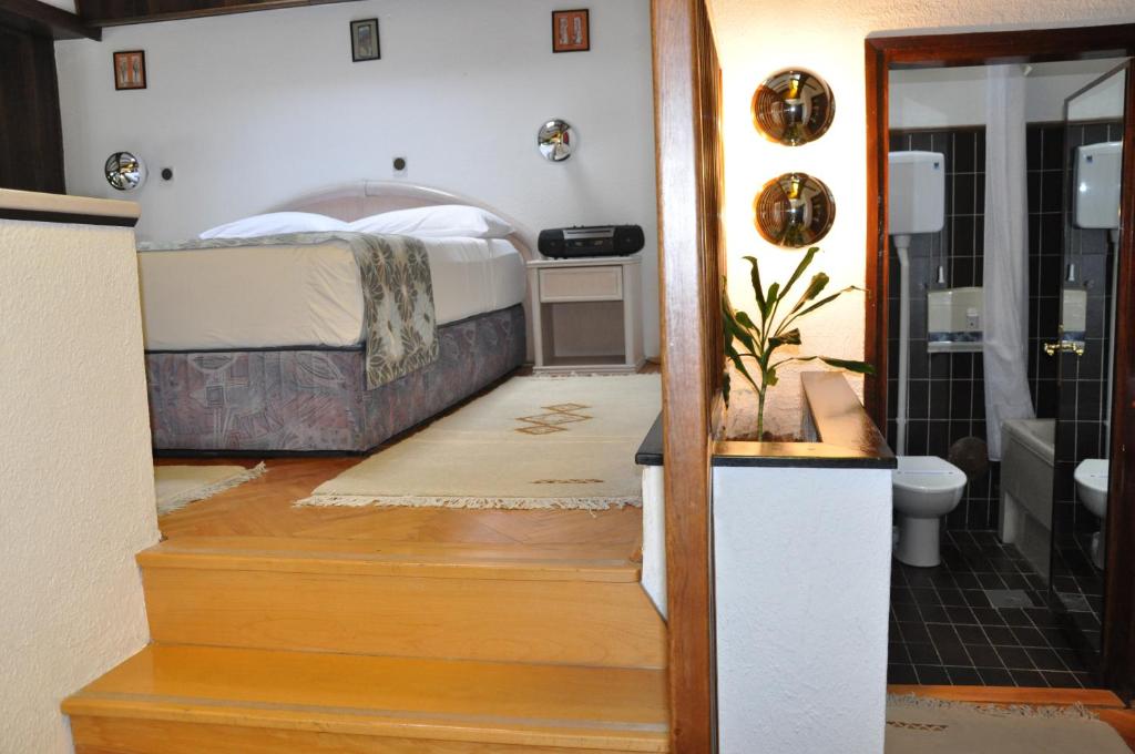 Postel nebo postele na pokoji v ubytování Hotel Simpo Pržar