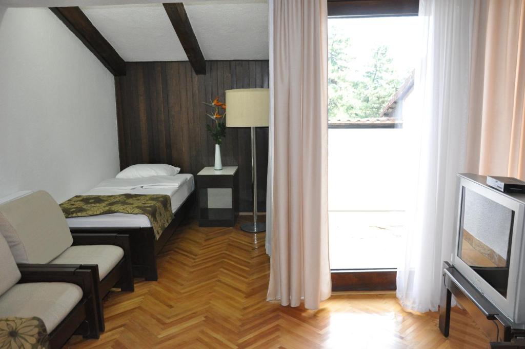 Postel nebo postele na pokoji v ubytování Hotel Simpo Pržar