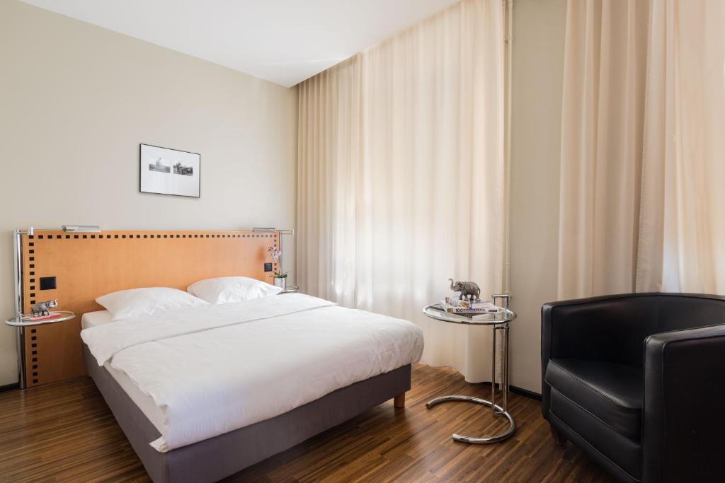 Voodi või voodid majutusasutuse GLANDON Rooms Elite toas