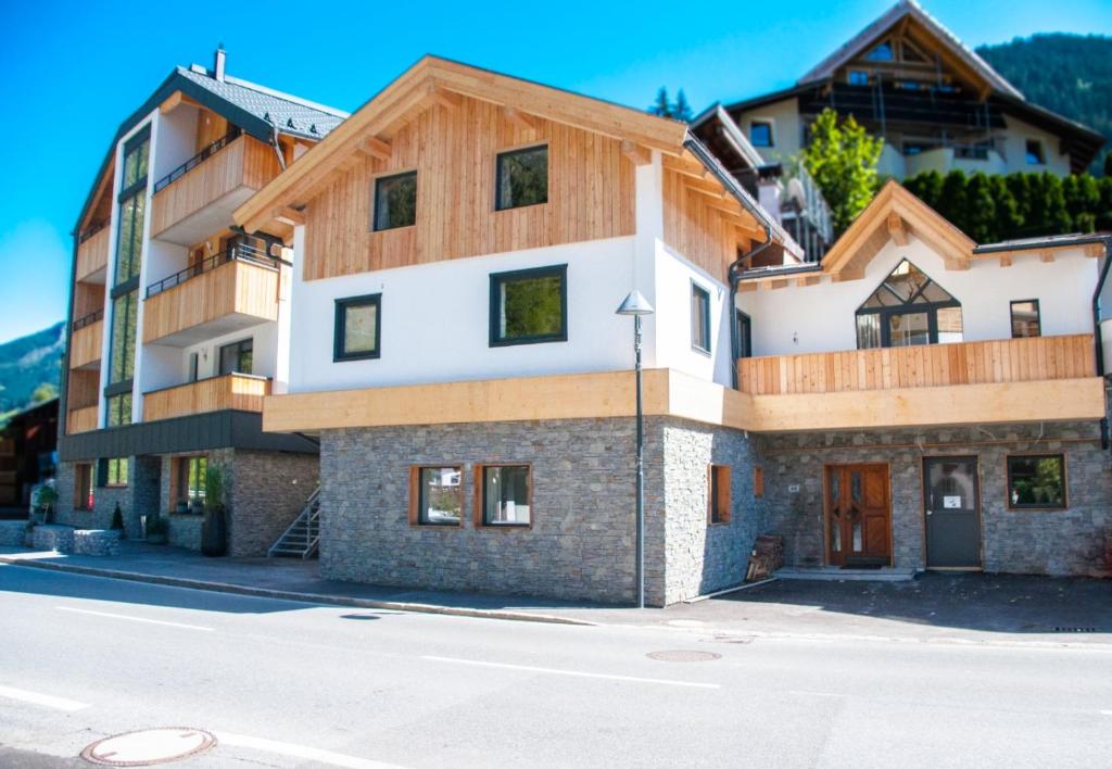 a building on the side of a street at Aparthotel Herzblick GmbH in See