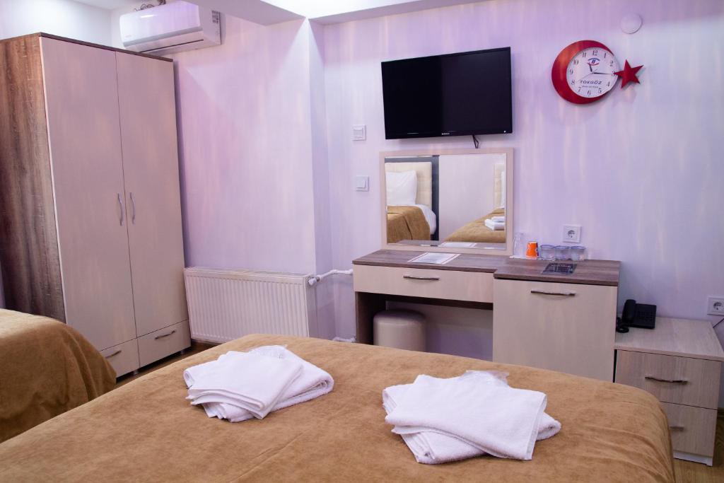 Postel nebo postele na pokoji v ubytování Figen Hotel