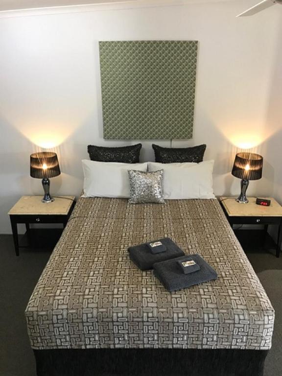 Postel nebo postele na pokoji v ubytování Central Motel Gin Gin