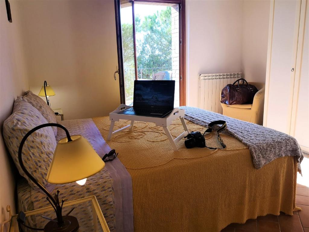 Posteľ alebo postele v izbe v ubytovaní Agriturismo Palazzo Conti - B