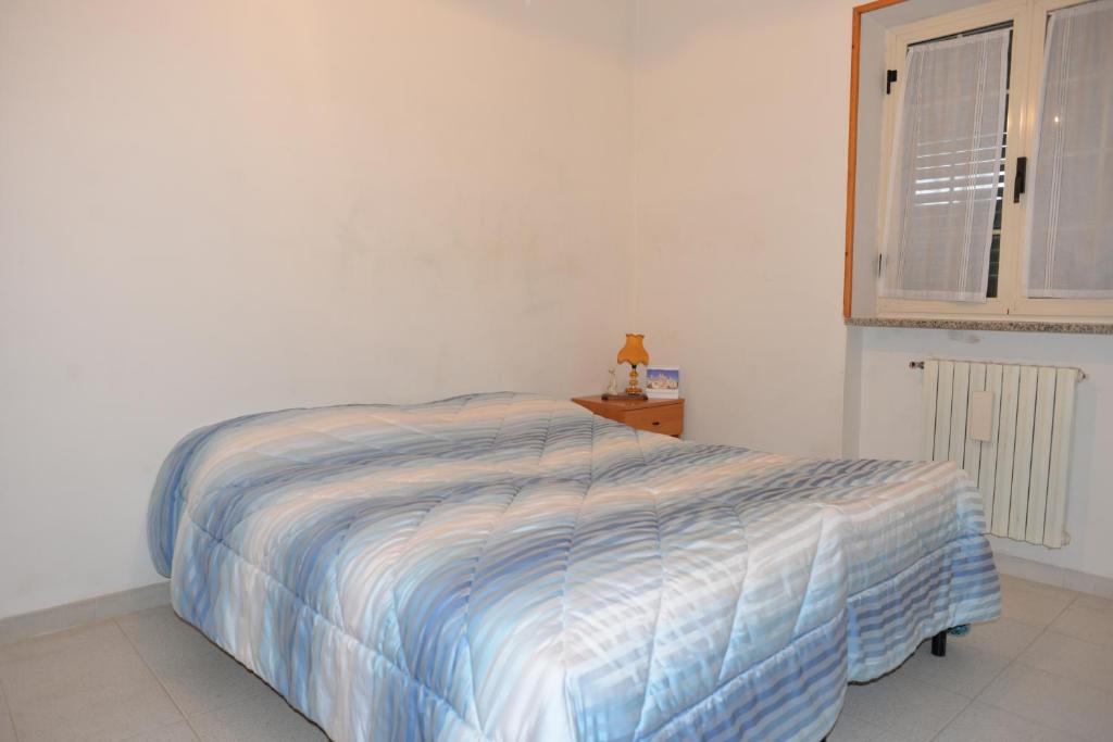 Postel nebo postele na pokoji v ubytování Trullo Cittadino