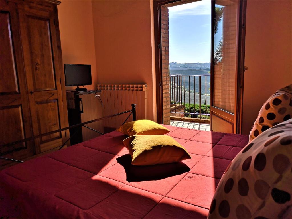 Posteľ alebo postele v izbe v ubytovaní Agriturismo Palazzo Conti - B