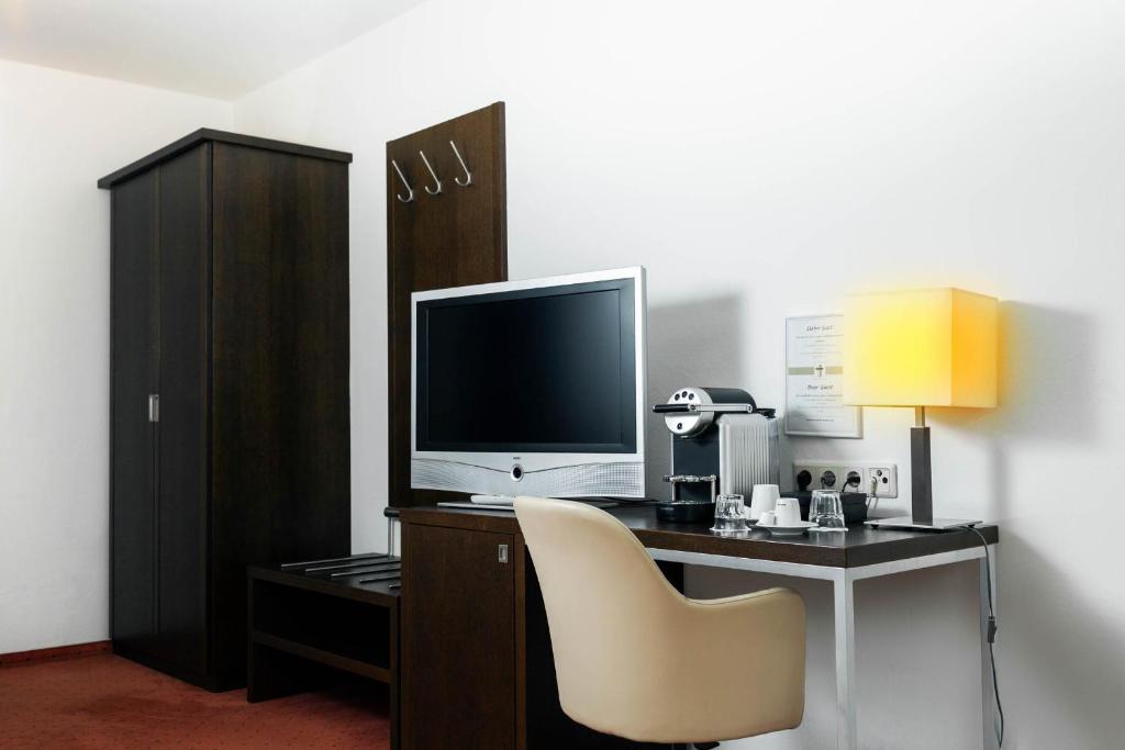 TV a/nebo společenská místnost v ubytování Hotel Plattenwirt