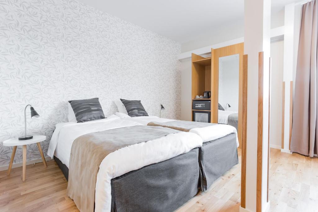 Postel nebo postele na pokoji v ubytování Hotel Spekeröd