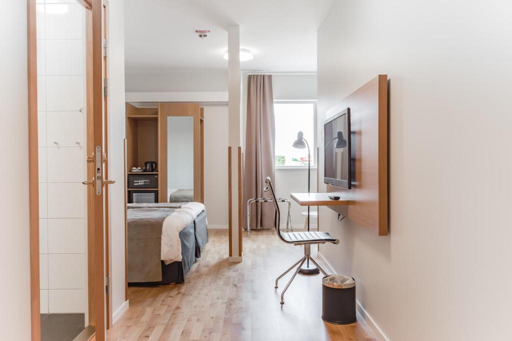 Postel nebo postele na pokoji v ubytování Hotel Spekeröd