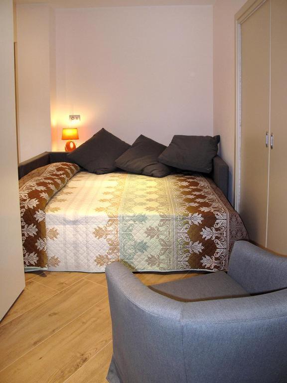 Postel nebo postele na pokoji v ubytování Vittoria Residence