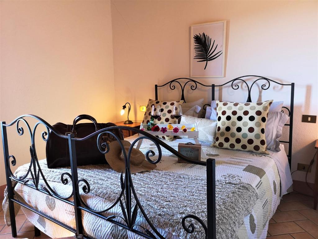 Posteľ alebo postele v izbe v ubytovaní Agriturismo Palazzo Conti - B