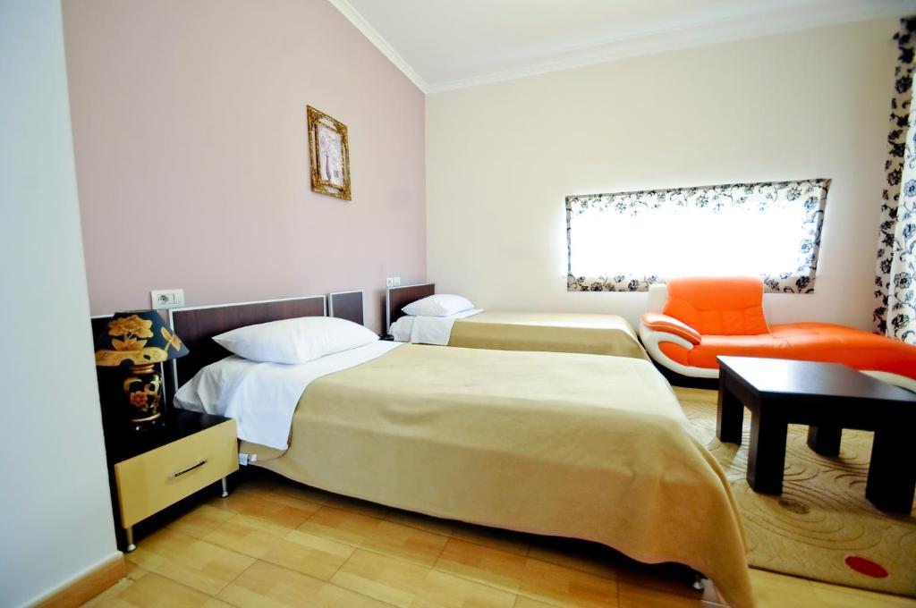 Postel nebo postele na pokoji v ubytování Hotel Lubjana