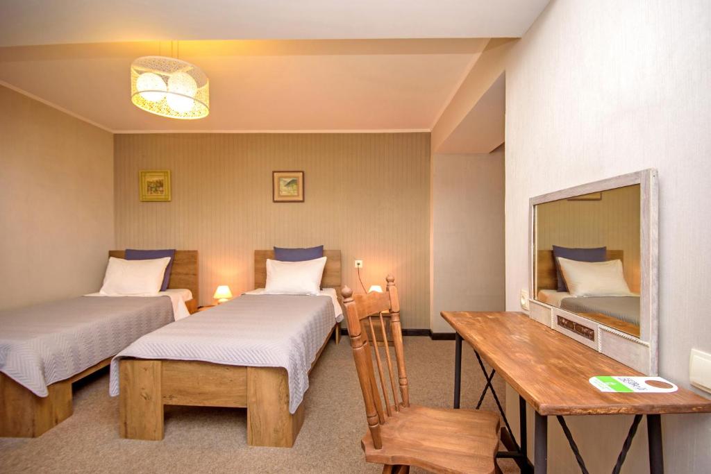 Postel nebo postele na pokoji v ubytování Hotel Libretto