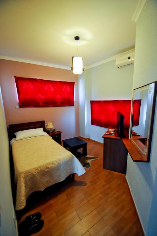 Postel nebo postele na pokoji v ubytování Hotel Lubjana