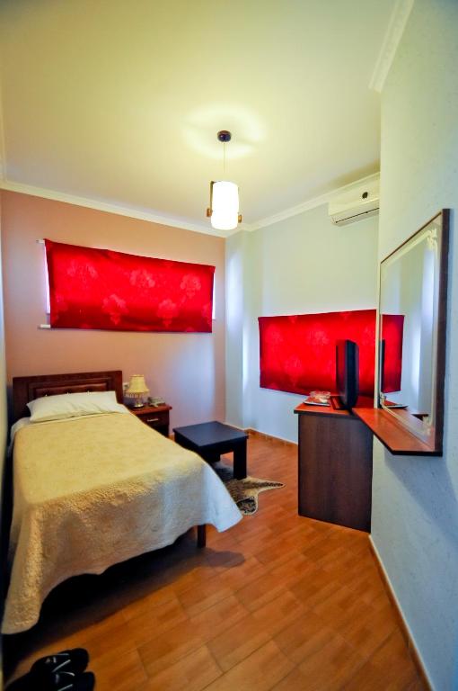 Postel nebo postele na pokoji v ubytování Hotel Lubjana
