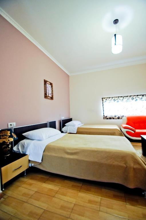 Postel nebo postele na pokoji v ubytování Hotel Lubjana