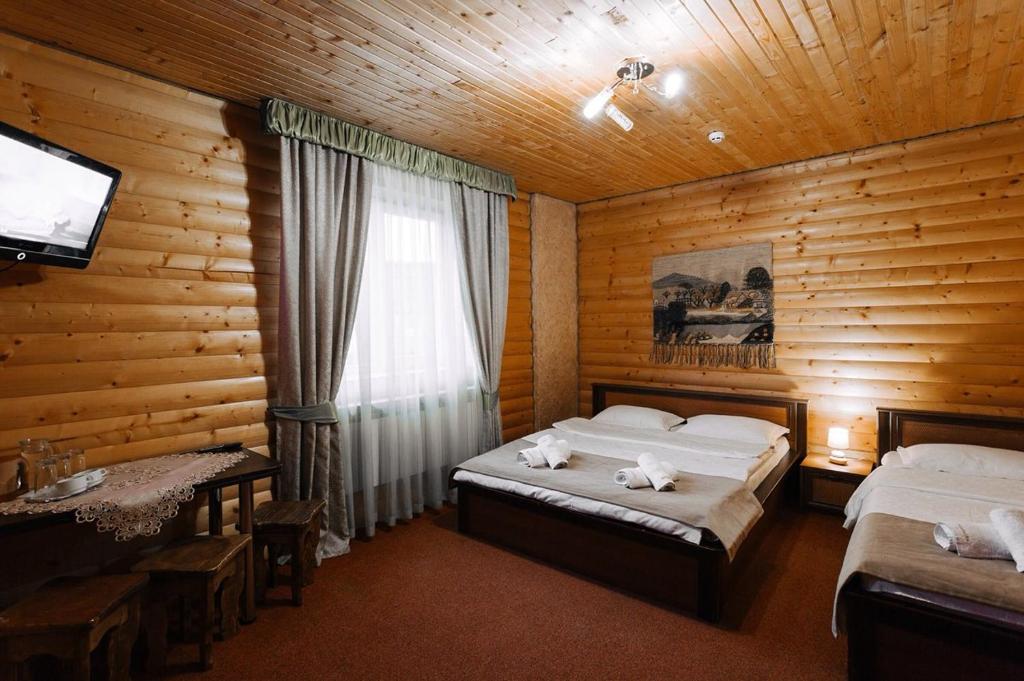 Postel nebo postele na pokoji v ubytování Hotel Marilen