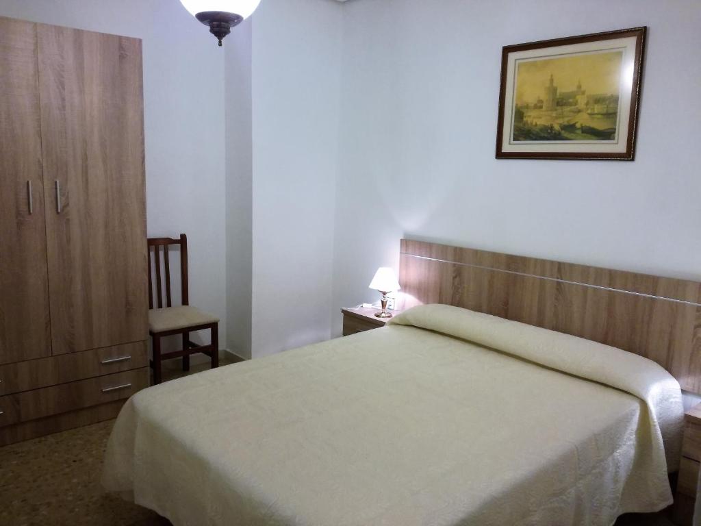 Postel nebo postele na pokoji v ubytování VIVIENDA COMPLETA EN SEVILLA