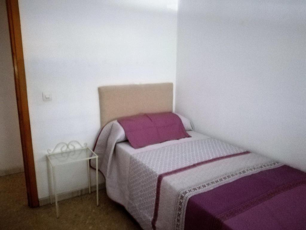 Postel nebo postele na pokoji v ubytování VIVIENDA COMPLETA EN SEVILLA