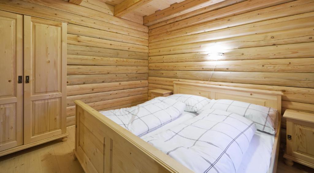 Postel nebo postele na pokoji v ubytování Pension Tereza & Šumavské Roubenky