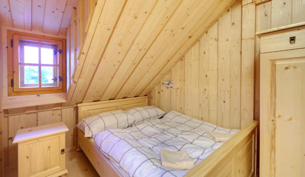 Postel nebo postele na pokoji v ubytování Pension Tereza & Šumavské Roubenky